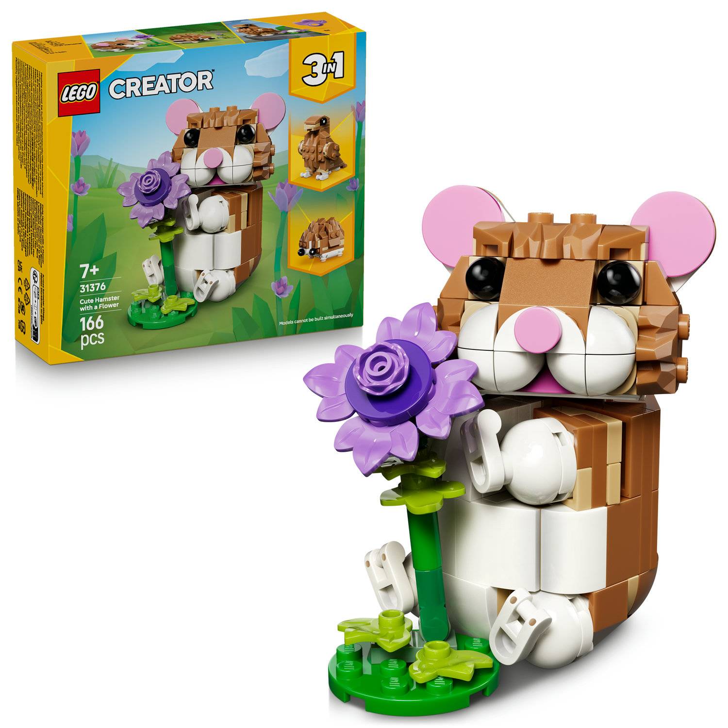 Ein LEGO Creator Set mit einem blockigen, braun-weißen Hamster, der eine lila Blume mit grünem Stiel hält. Die Schachtel zeigt 3-in-1 Bauoptionen.