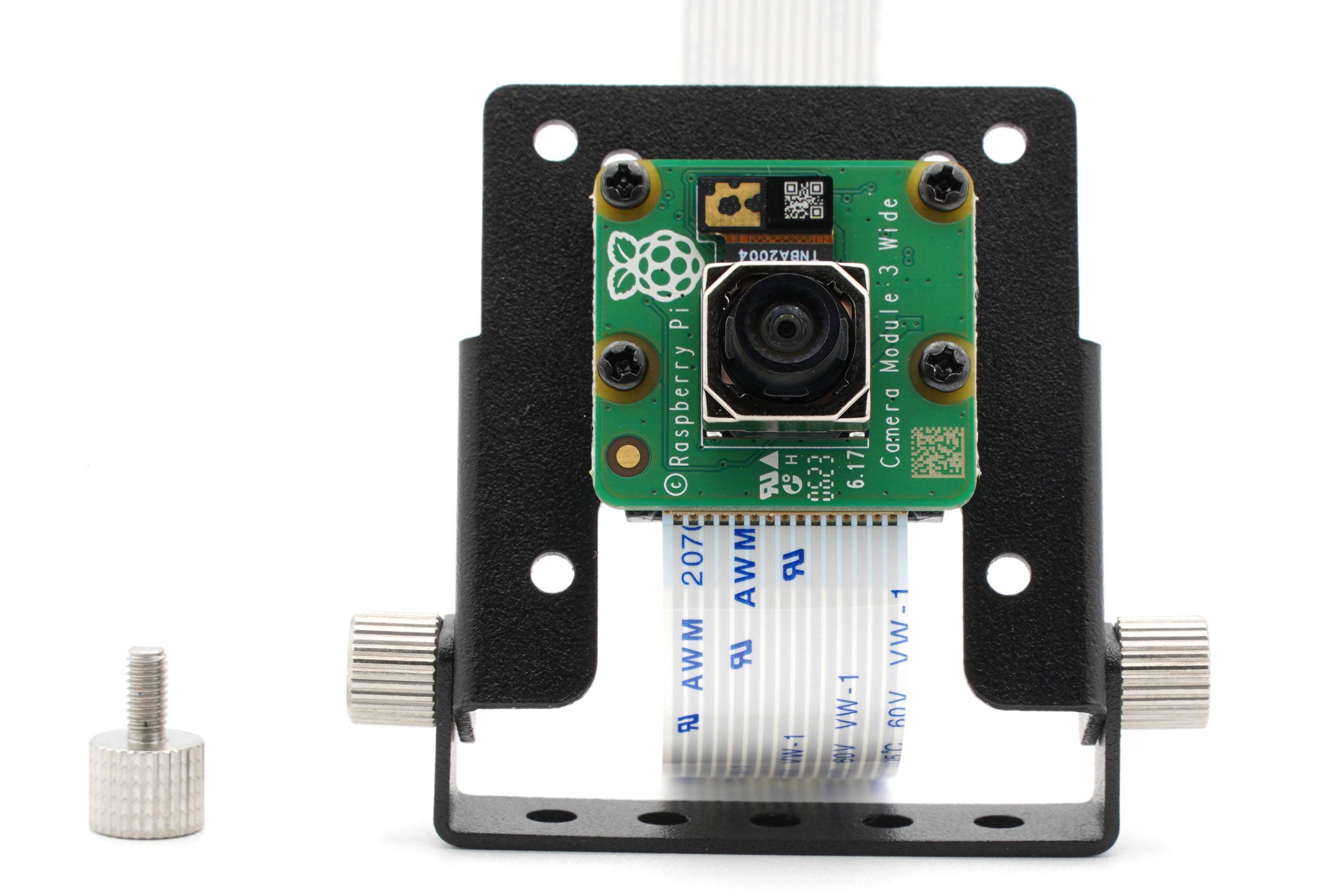 Eine kleine schwarze Computereinheit mit mehreren USB- und Ethernet-Anschlüssen, mit einem angeschlossenen Kameramodul mit verstellbarem Objektiv.