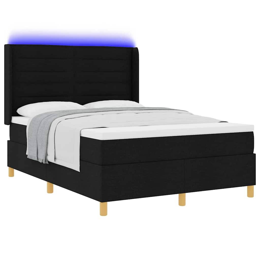 Ein modernes, schwarz gepolstertes Bett mit hohem Kopfteil und blauer LED-Beleuchtung, ausgestattet mit Bettwäsche in Weiß und Grau, gestützt auf Holzbeine.