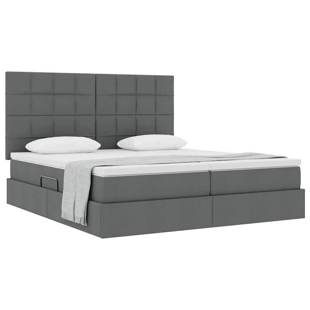Ein modernes graues Bett mit einem großen, gittermustrigen Kopfteil, weißer Bettwäsche und zwei Kissen, das ein minimalistisches und elegantes Design ausstrahlt.