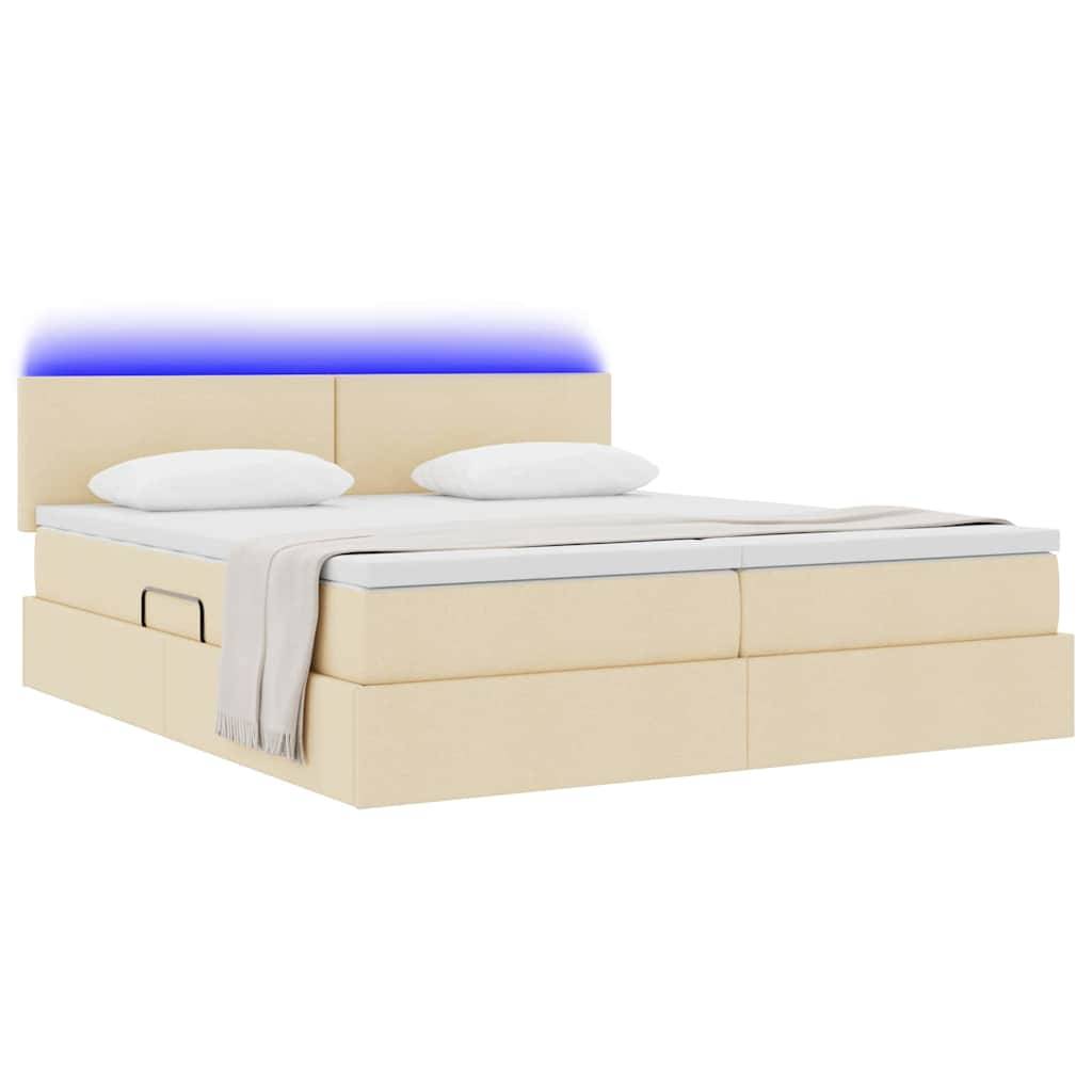 Ein beiges Plattformbett mit integrierten Schubladen zur Aufbewahrung, weiße Bettwäsche und ein sanftes blaues LED-Licht auf dem Kopfteil. Zwei Kissen auf dem Bett.