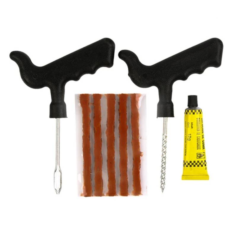 Reifenreparaturset mit zwei T-Griff-Werkzeugen, Gummiflicken und Klebstofftuben zum Reparieren von Reifenpannen.