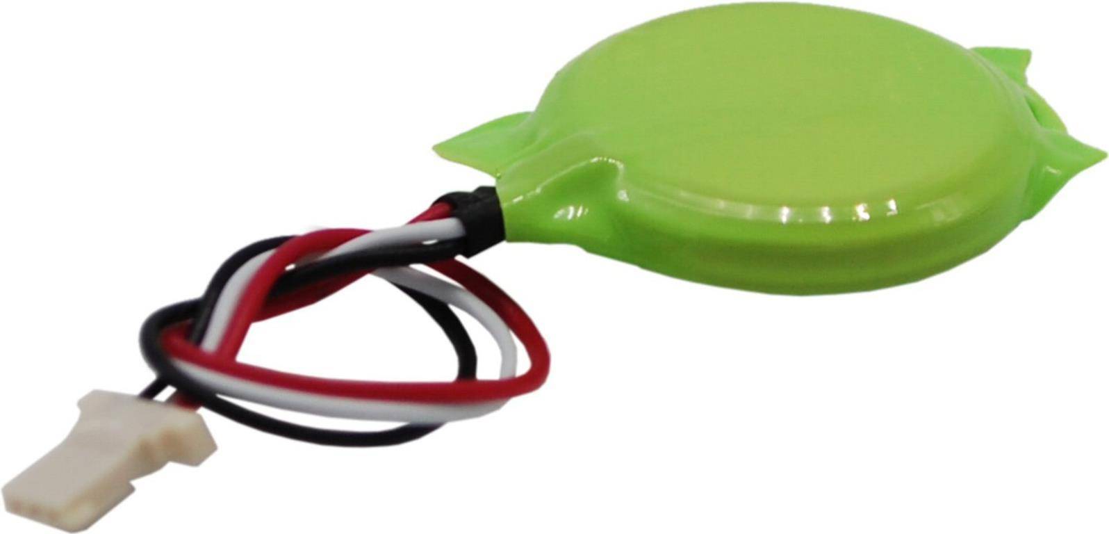 Eine grüne, runde elektrische Komponente mit drei schwarzen, roten und weißen Drähten, die von ihrer Seite abgehen.