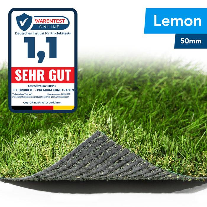 Ein Grasstück mit gefalteter Ecke zeigt eine Dicke von 50 mm. Ein Etikett bewertet es als „Sehr Gut