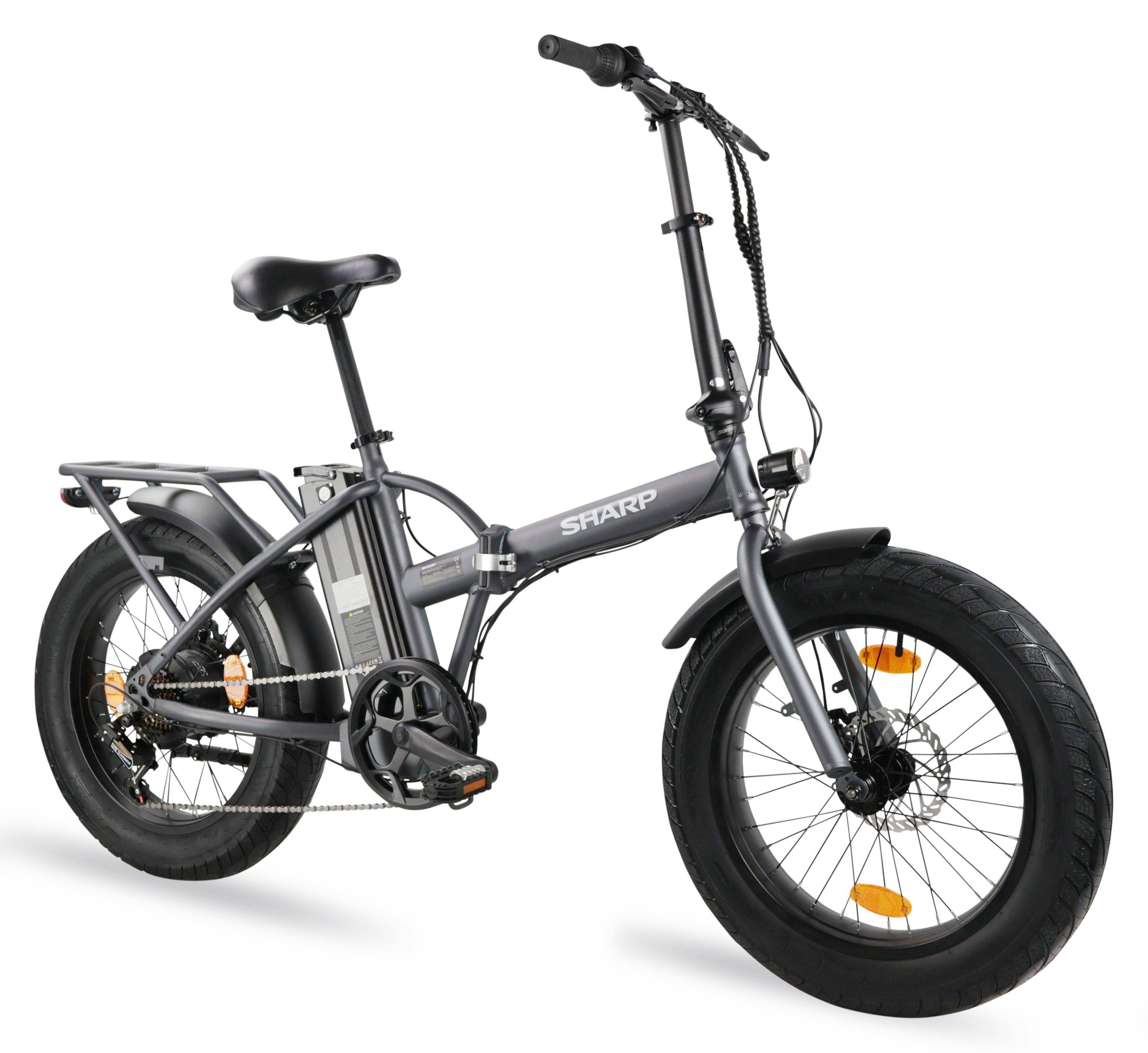 Ein graues Klapp-E-Bike mit großen Reifen, einem Akkupack hinten und einem 