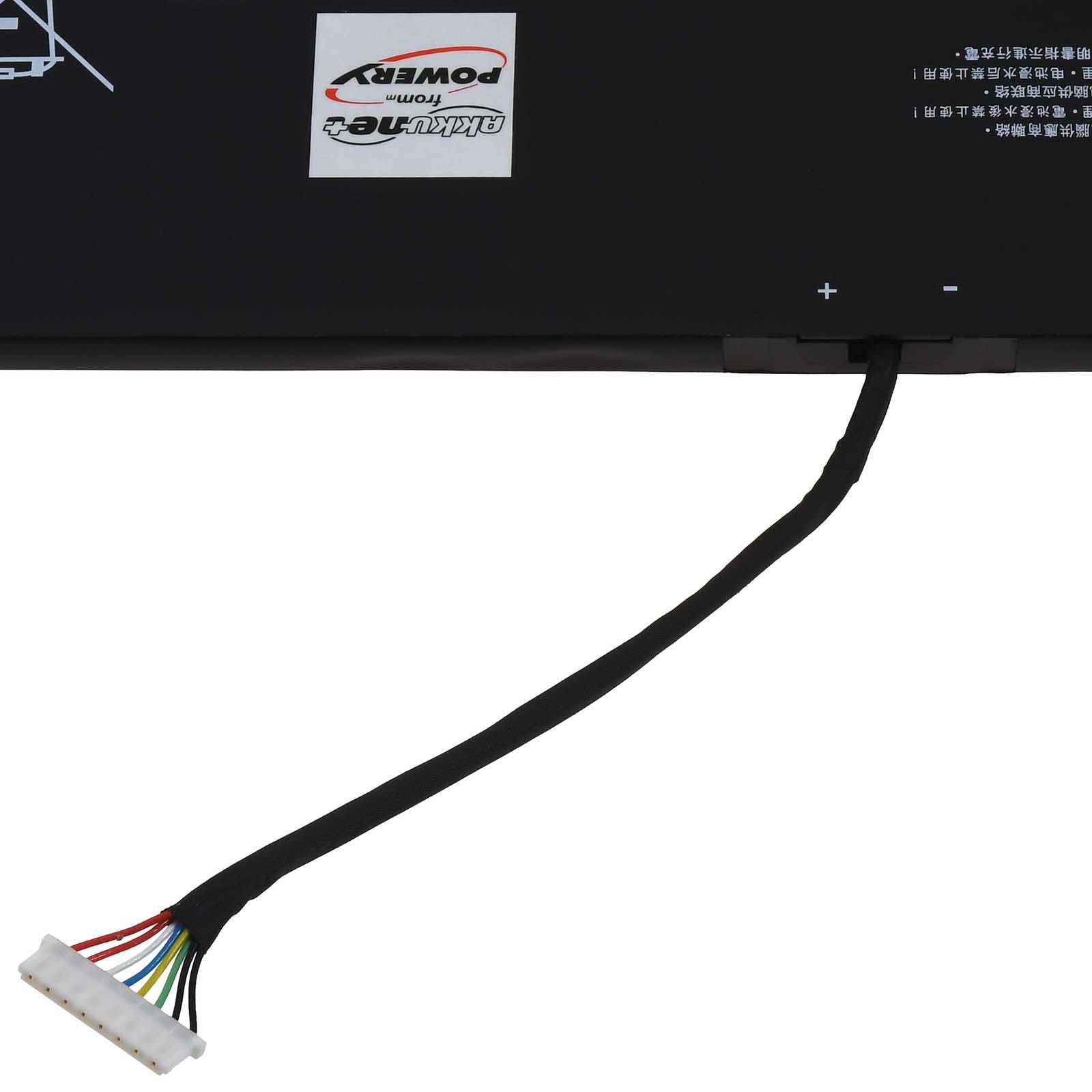 Ein Laptop-Akku mit einem angeschlossenen Stromkabel mit mehreren farbigen Drähten.