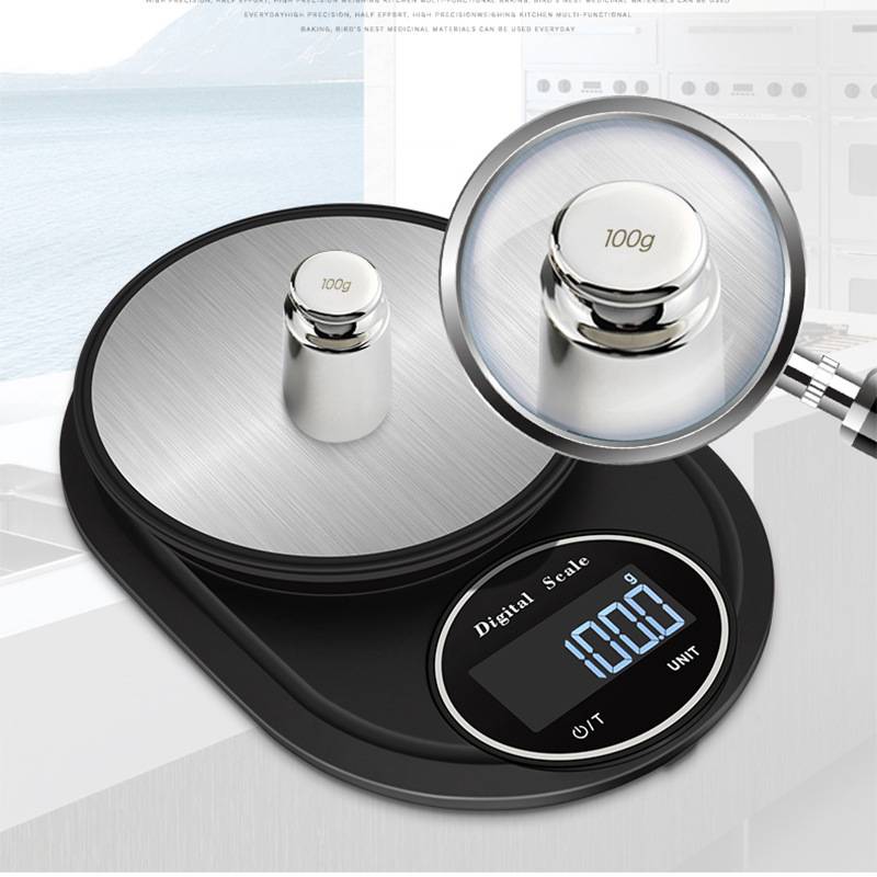 Digitale Waage mit rundem Tablett mit der Anzeige „100,0 g