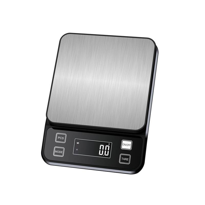 Eine digitale Küchenwaage mit einer metallischen Wiegeplattform und einem LCD-Display, auf dem „0,0