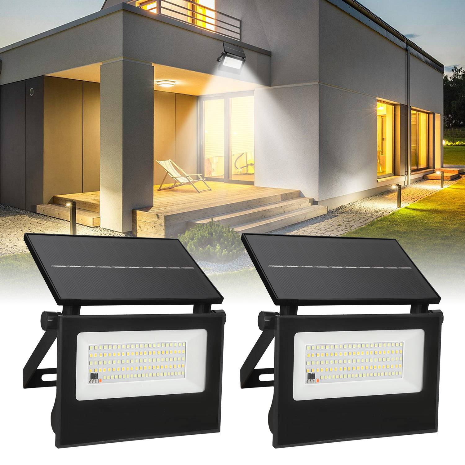 Modernes Hausäußeres bei Nacht, beleuchtet durch solar-betriebene LED-Flutlichter, die im Vordergrund positioniert sind.