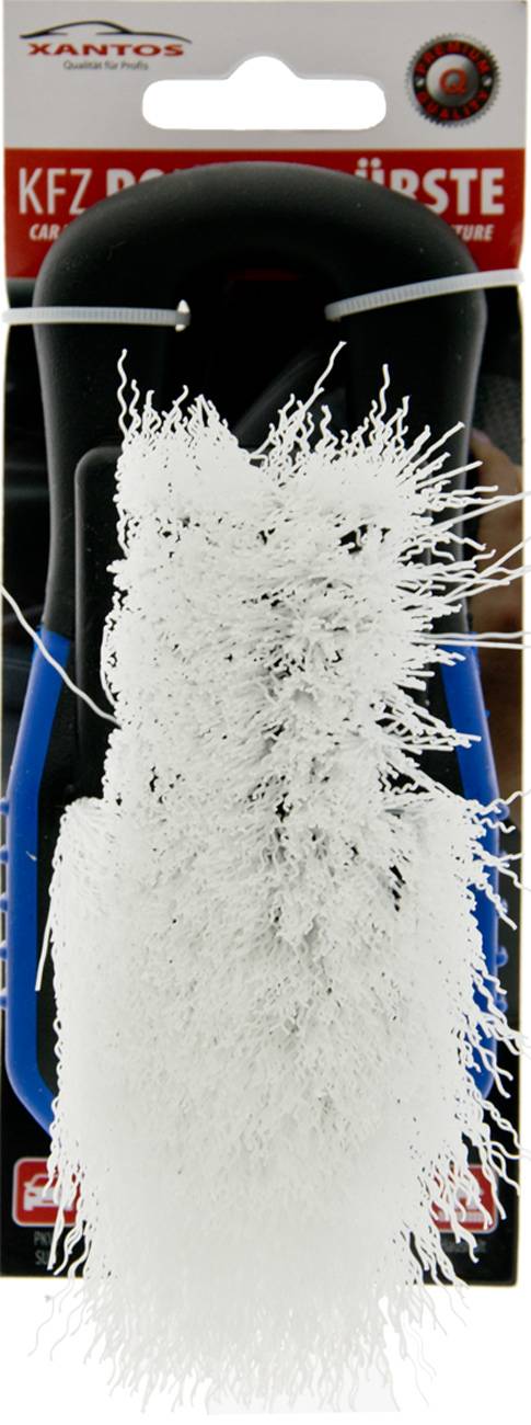 Ein Nahaufnahmebild einer weißen Bürste mit dicht gepackten Borsten, möglicherweise zum Reinigen verwendet. Der Griff ist teilweise in Blau sichtbar.