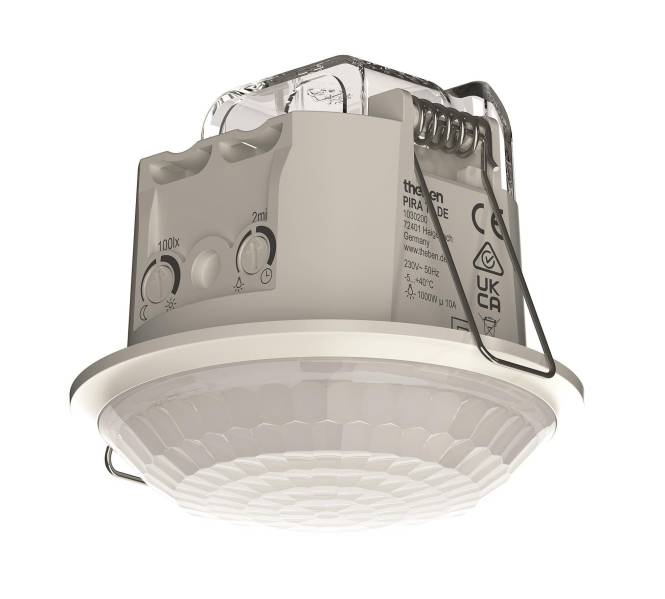 Deckenmontagemotionssensor mit Einstellreglern und Beschriftung, verwendet für energieeffiziente Beleuchtungskontrolle in Gebäuden.