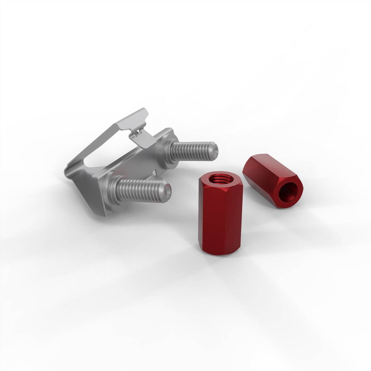 Ein Metallclip mit zwei Gewindeschrauben liegt neben einer roten sechskantigen Kupplungsmutter und einer roten Schraube, angeordnet auf einer weißen Oberfläche.