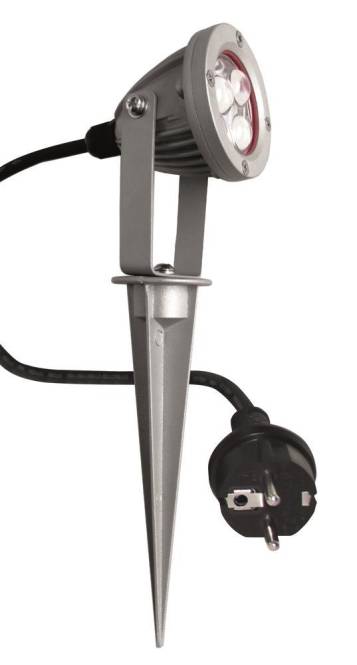 Ein grauer Außenstrahler mit Erdspieß und angeschlossenem schwarzem Stromkabel, verwendet für Garten- oder Landschaftsbeleuchtung.