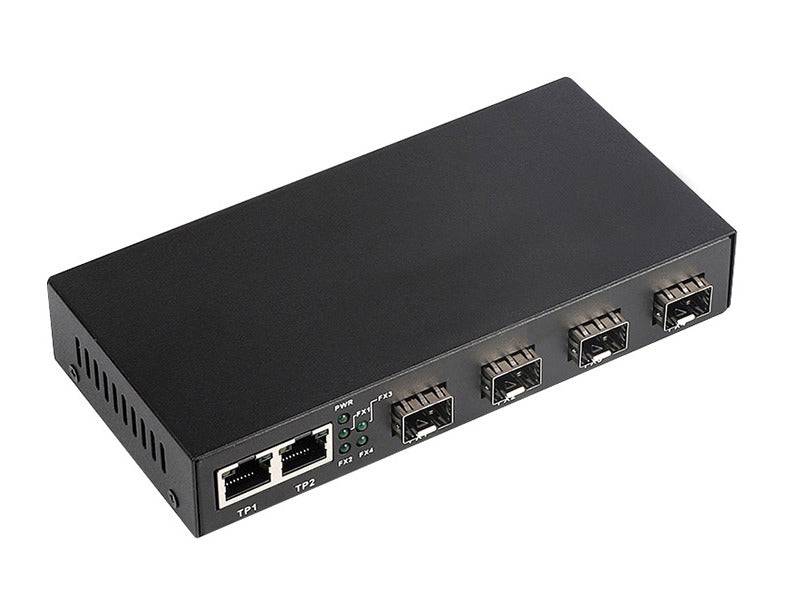 Schwarzer Netzwerk-Switch oder Media-Konverter mit zwei Ethernet-Anschlüssen, vier Fiber-/SFP-Anschlüssen und Statusleuchten auf der Frontblende.