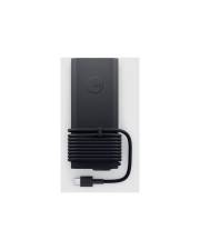 Ein schwarzer rechteckiger Stromadapter mit einem um seine Basis gewickelten Spiralkabel, das an seinem Ende einen USB-C-Anschluss aufweist.