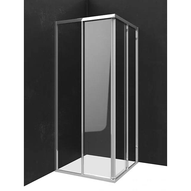 Ein modernes Glasduschgehäuse mit Chromrahmen, in einer Ecke gegen eine dunkle Wand und weißen Boden dargestellt.