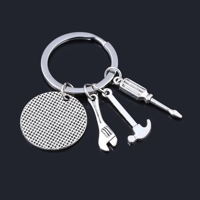 Schlüsselanhänger mit Werkzeugen und Text Silber