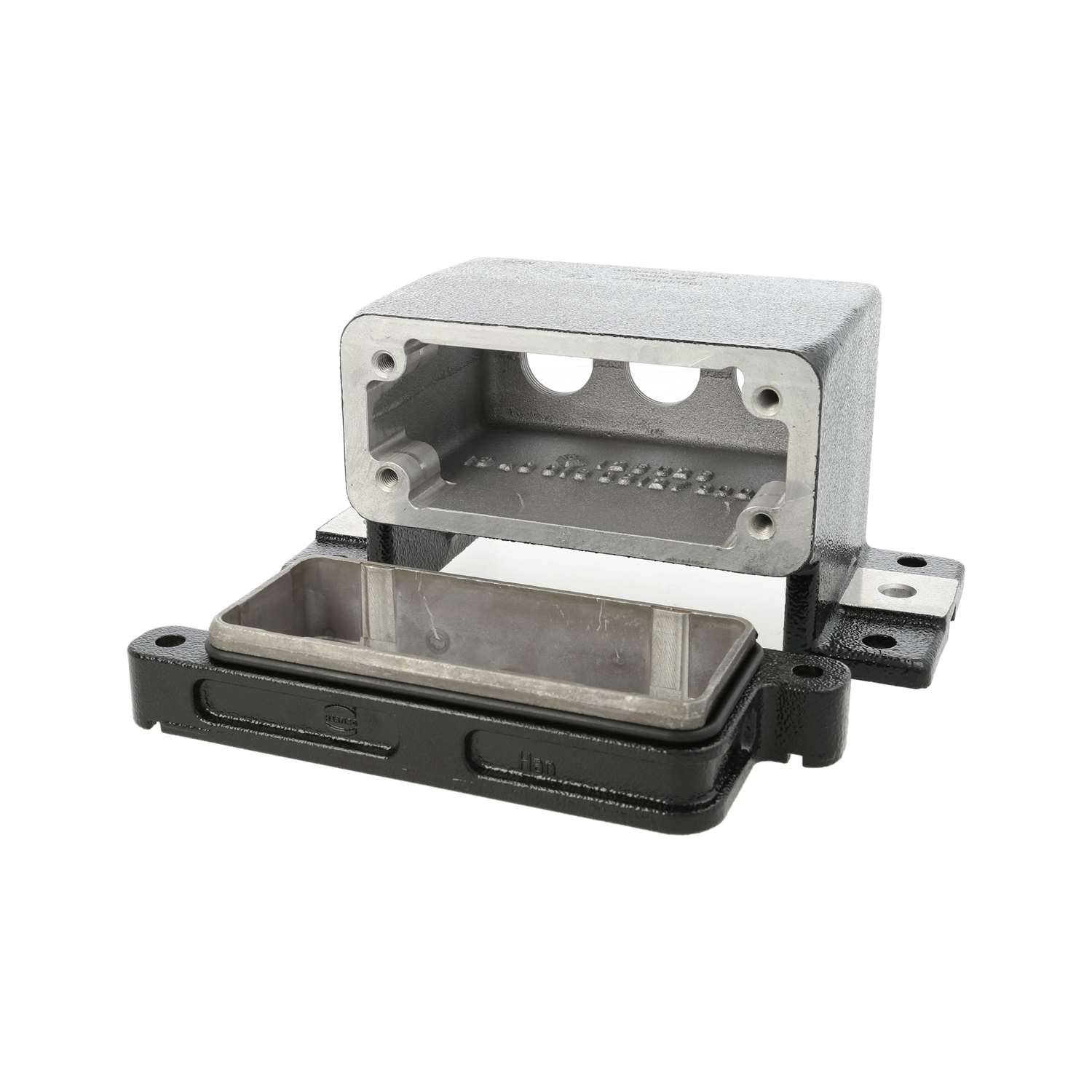 Metallisches Elektrogehäuse mit abnehmbarem rechteckigen Deckel, dargestellt in offener Position, das den inneren Hohlraum und die Basisgehäuse offenbart.