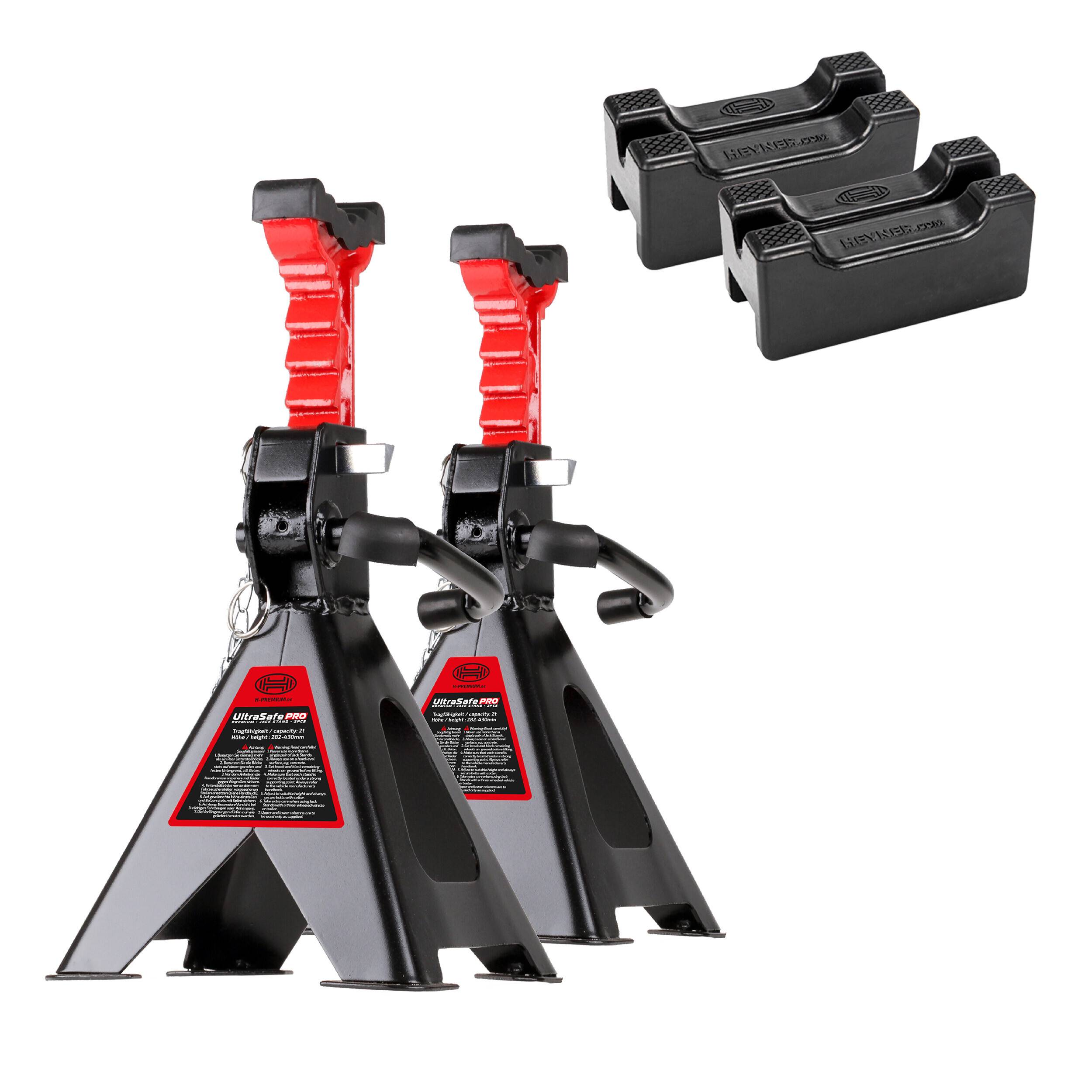 Ein Paar rote und schwarze Rangierwagenheber mit drei Gummi-Hebepads. Die Rangierwagenheber sind so konzipiert, dass sie Fahrzeuge während Reparaturen sicher anheben.