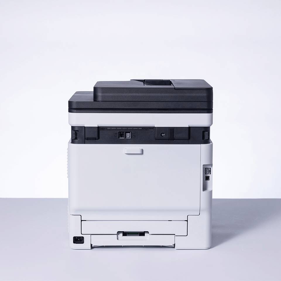 Kompakter schwarz-weißer Multifunktionsdrucker von vorne vor einem hellen, einfachen Hintergrund.