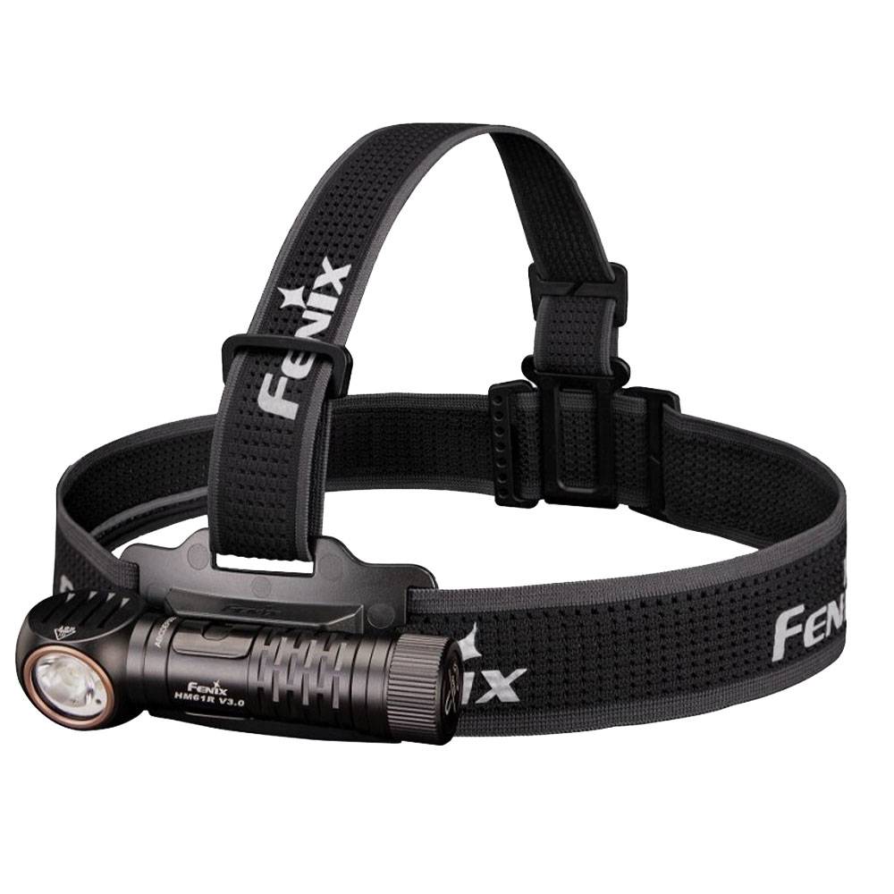 Black Fenix Stirnlampe mit verstellbarem elastischen Kopfband, abgebildet aufgerollt mit der befestigten Lampe auf weißem Hintergrund.