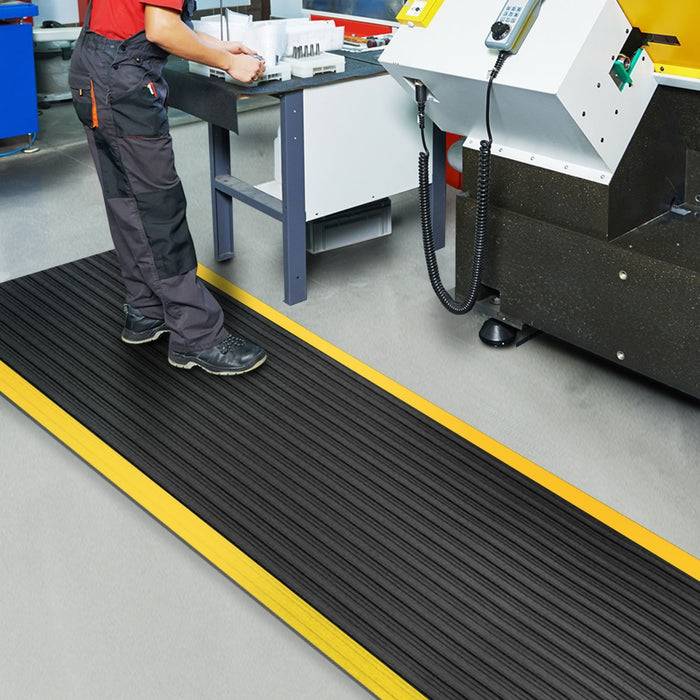 FLOORDIREKT Anti-Ermüdungsmatte Softer-Work-Mat - Dämpfende Arbeitsmatte - Entlastung für Gelenke & Wirbelsäule - 150 x 120 cm - Schwarz-Gelb