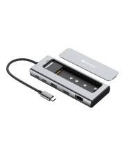 USB-C-Dockingstation mit HDMI, USB-Anschlüssen, Ethernet und integriertem Kabel, dargestellt mit abnehmbarer Abdeckung.