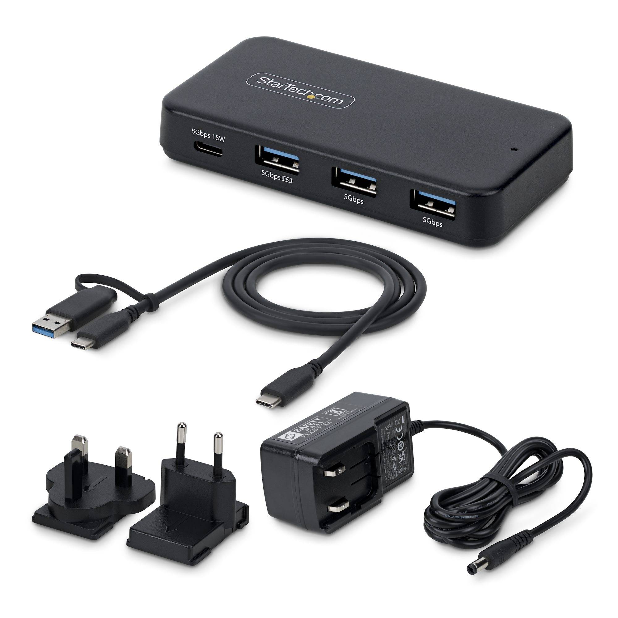 StarTech USB-C-Hub mit drei USB-A-Anschlüssen und Kabel, plus Stromadaptern und Ladegerät auf weißem Hintergrund.