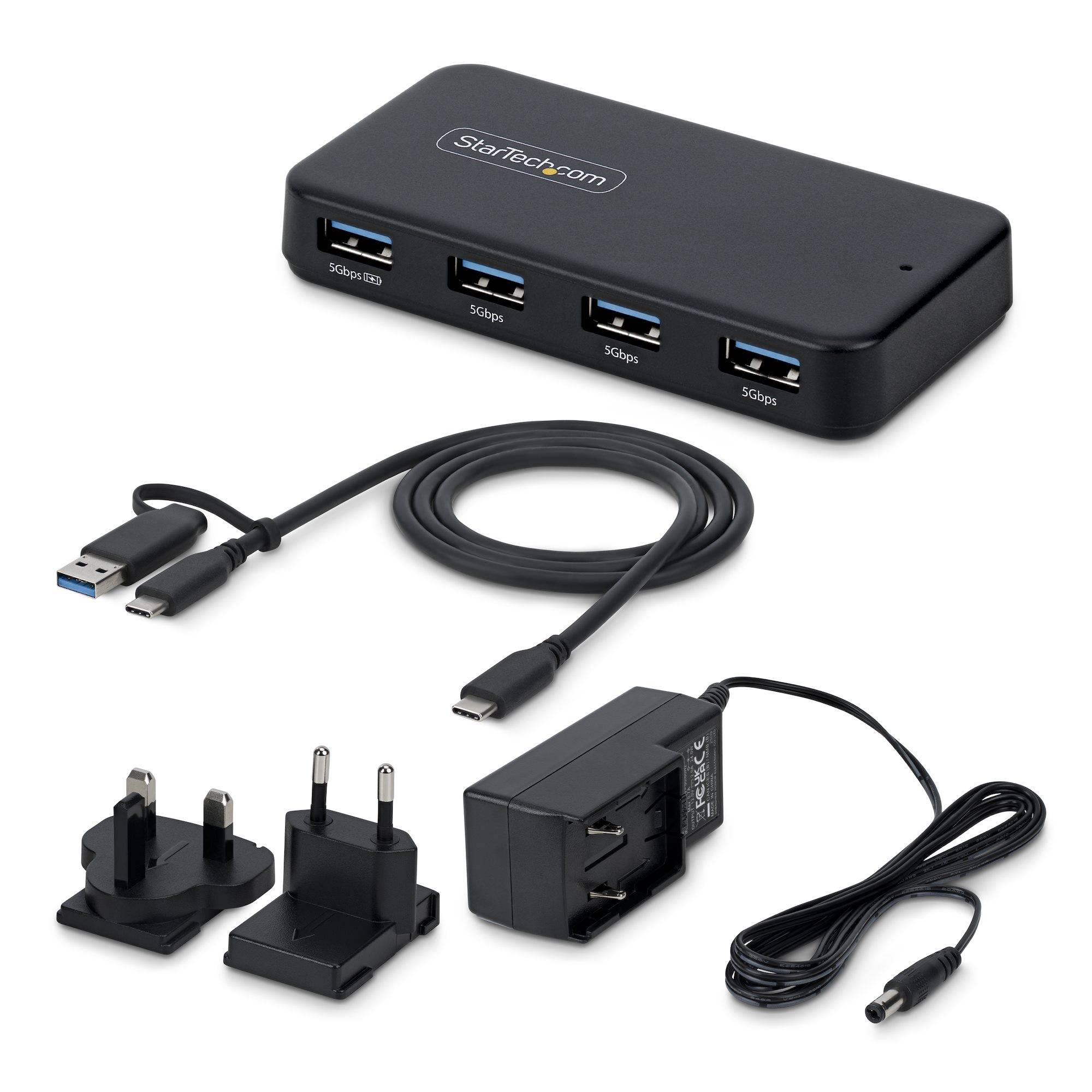 USB 3.0 Hub-Set mit 4-Port-Hub, Kabel, internationalen Stromsteckern und Netzteil auf weißem Hintergrund.