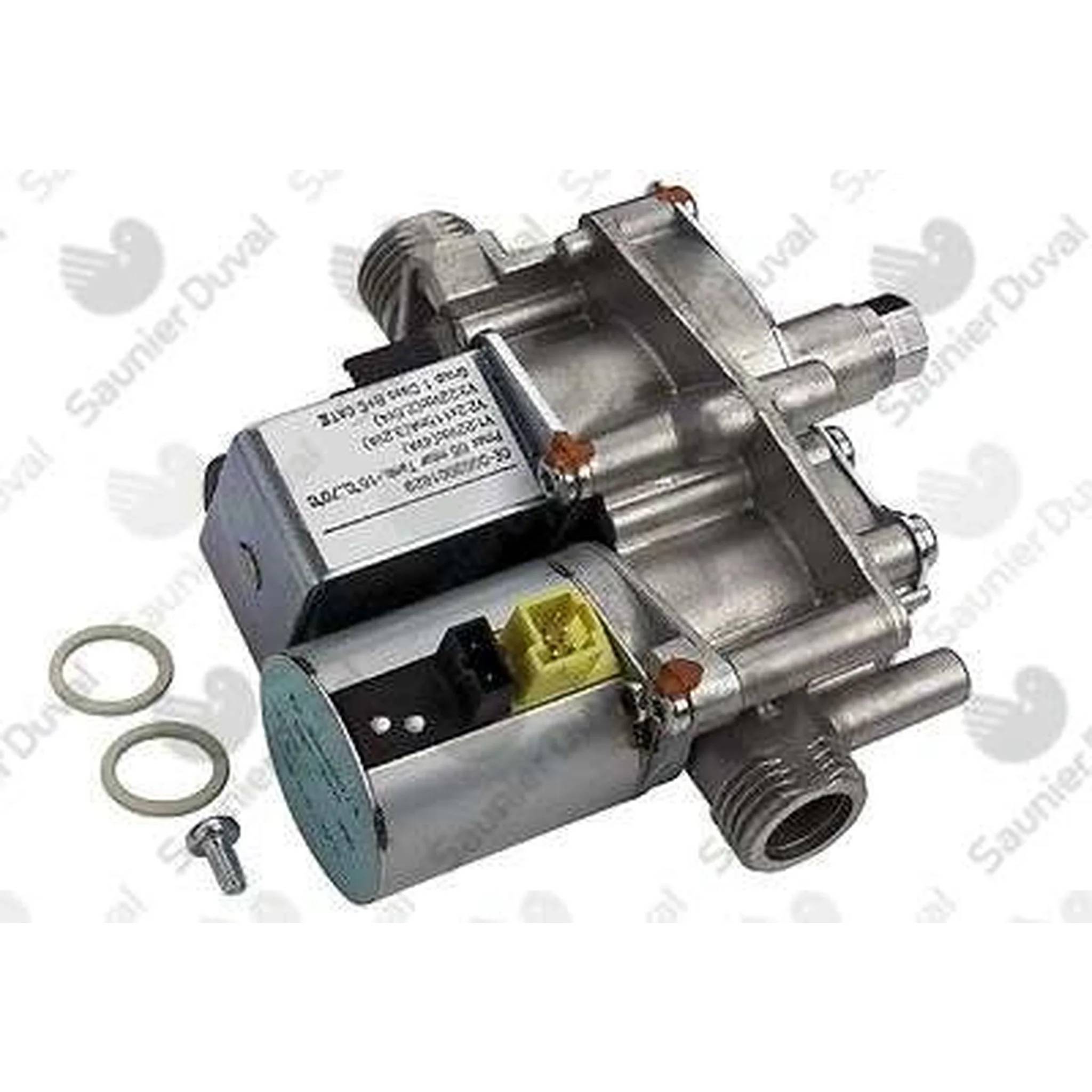 Metallische Gasventilbaugruppe mit zwei Magnetspulen, Gewinde-Anschlüssen und einer daneben auf weißem Hintergrund gezeigten Schraube.