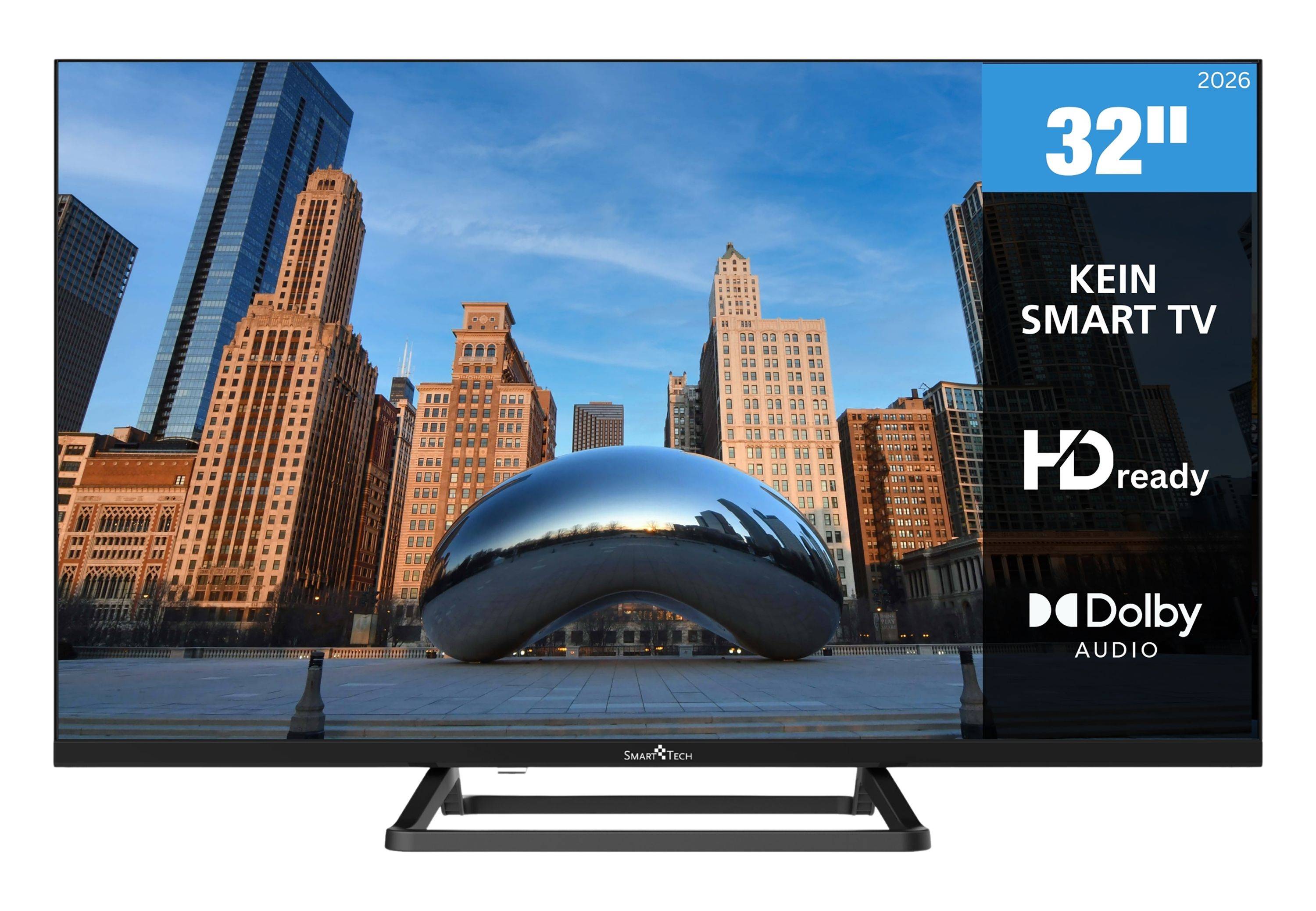 32-Zoll-KEIN Smart-TV mit HD-Ready und Dolby-Audio-Branding, auf dem Bildschirm eine Stadtsilhouette und eine reflektierende bohnenförmige Skulptur zu sehen.
