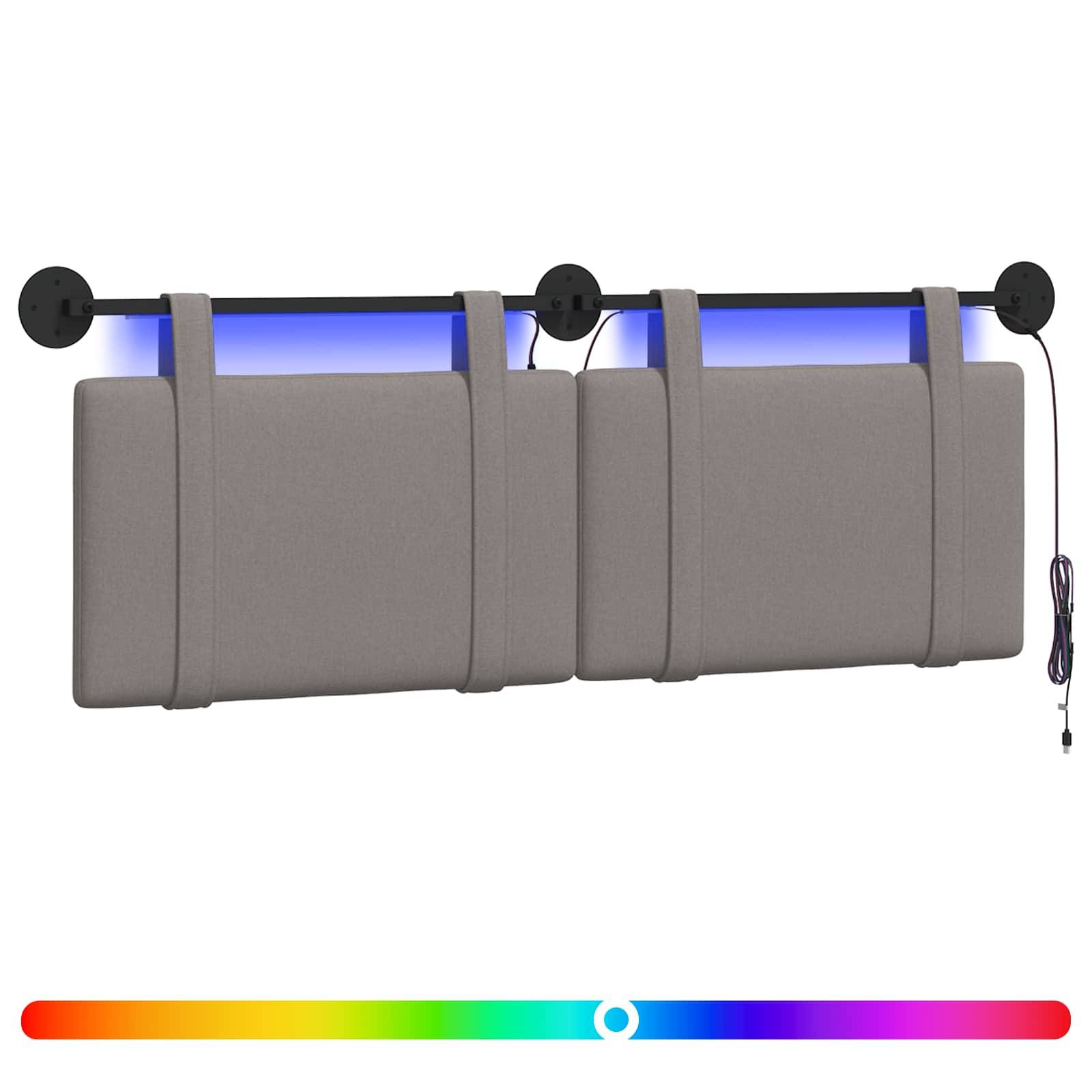 Grau gepolstertes, wandmontiertes Kopfteil mit blauer Hintergrundbeleuchtung und einstellbarem RGB-Farbschieber darunter.