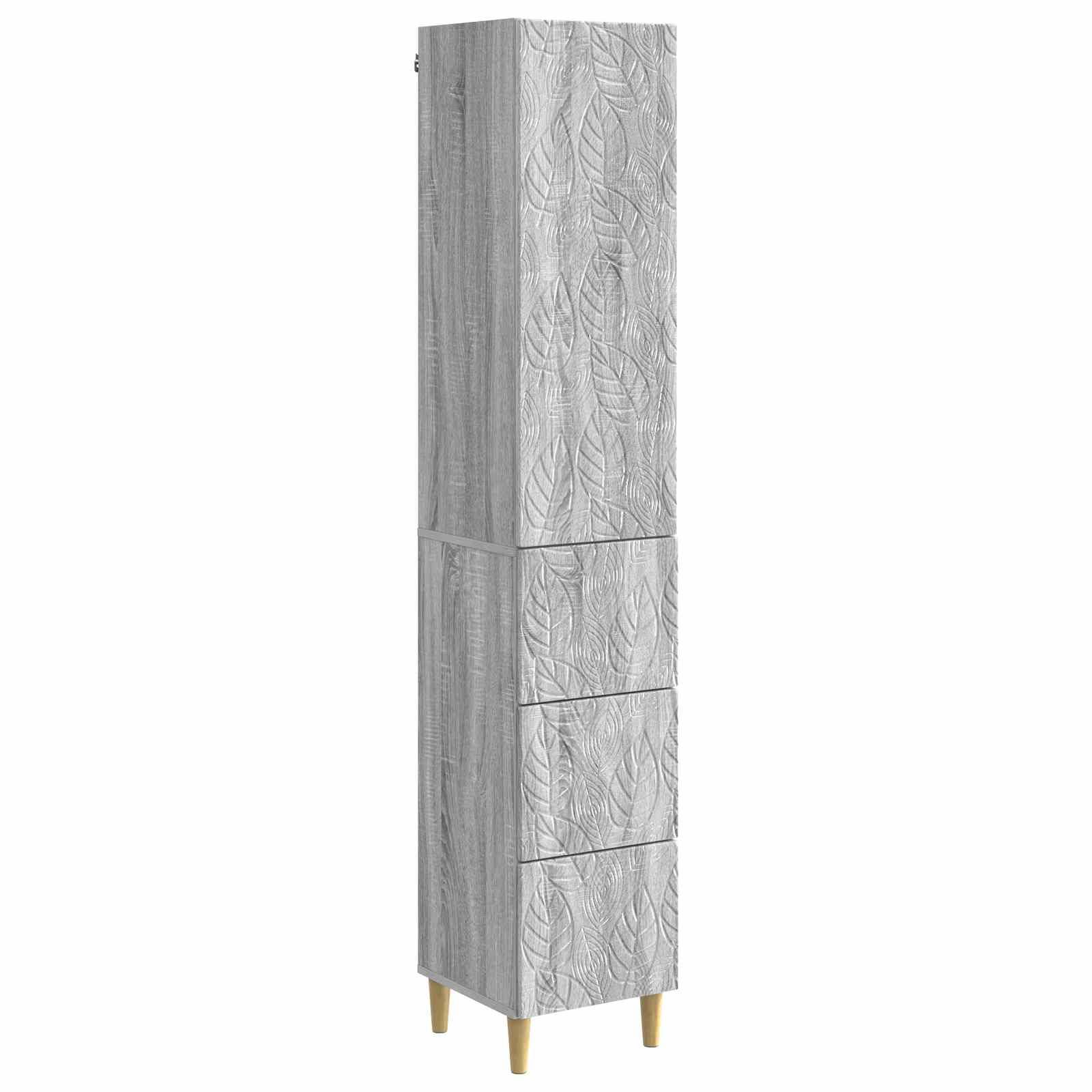 Hohes, schmales Schrank aus Holz mit grauer Holzmaserung, Frontpaneele mit Blattmuster und drei Schubladen, stehend auf vier Holzbeinen.