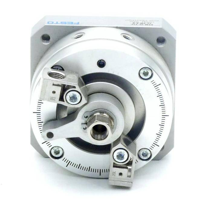 Nahaufnahme eines silbernen industriellen Rotationsgeräts mit einer kreisförmigen Skala, Befestigungsbolzen und zwei verstellbaren Sensor- oder Klemmarm.
