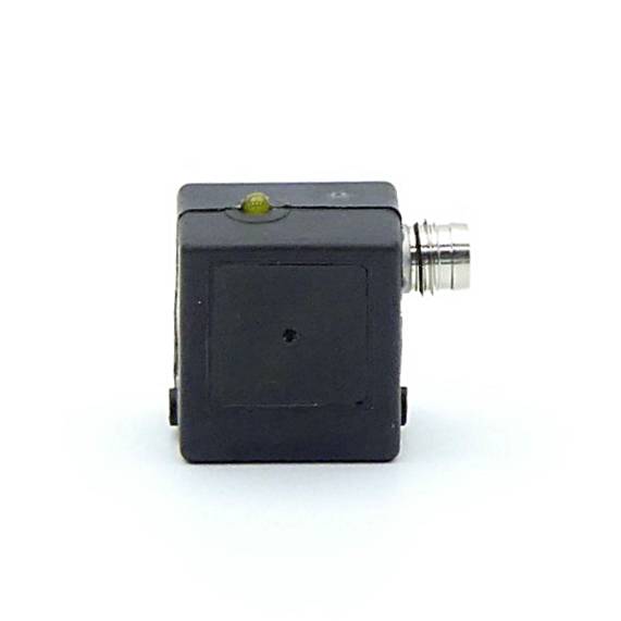 Kleines schwarzes würfelförmiges elektronisches Sensor- oder Kameramodul mit einem vorstehenden Metallstecker auf der rechten Seite und einer winzigen grünen Anzeigeleuchte oben.