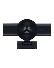 Schwarze Webcam oder Kamera, die oben auf einem rechteckigen Gerät montiert ist, zentriert auf weißem Hintergrund.