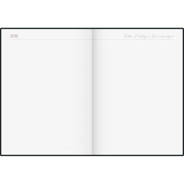 Ein offenes leeres Planer-Doppelblatt für 2036 mit einer schwachen gepunkteten linken Seite und einer leeren rechten Seite, plus einer kleinen Kopfzeile in Kursivschrift oben rechts.