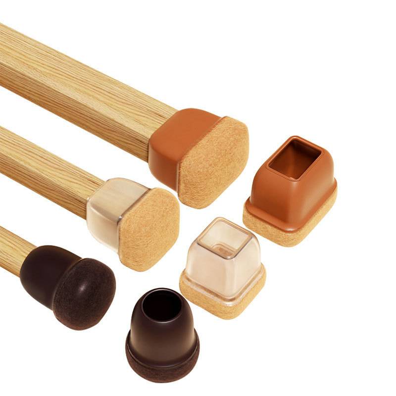 Mehrere Stuhlbeinkappen aus Holz und Schaumstoff in verschiedenen Farben und Formen sind auf weißem Hintergrund ausgestellt, einschließlich quadratischer und runder Schutzkappen.