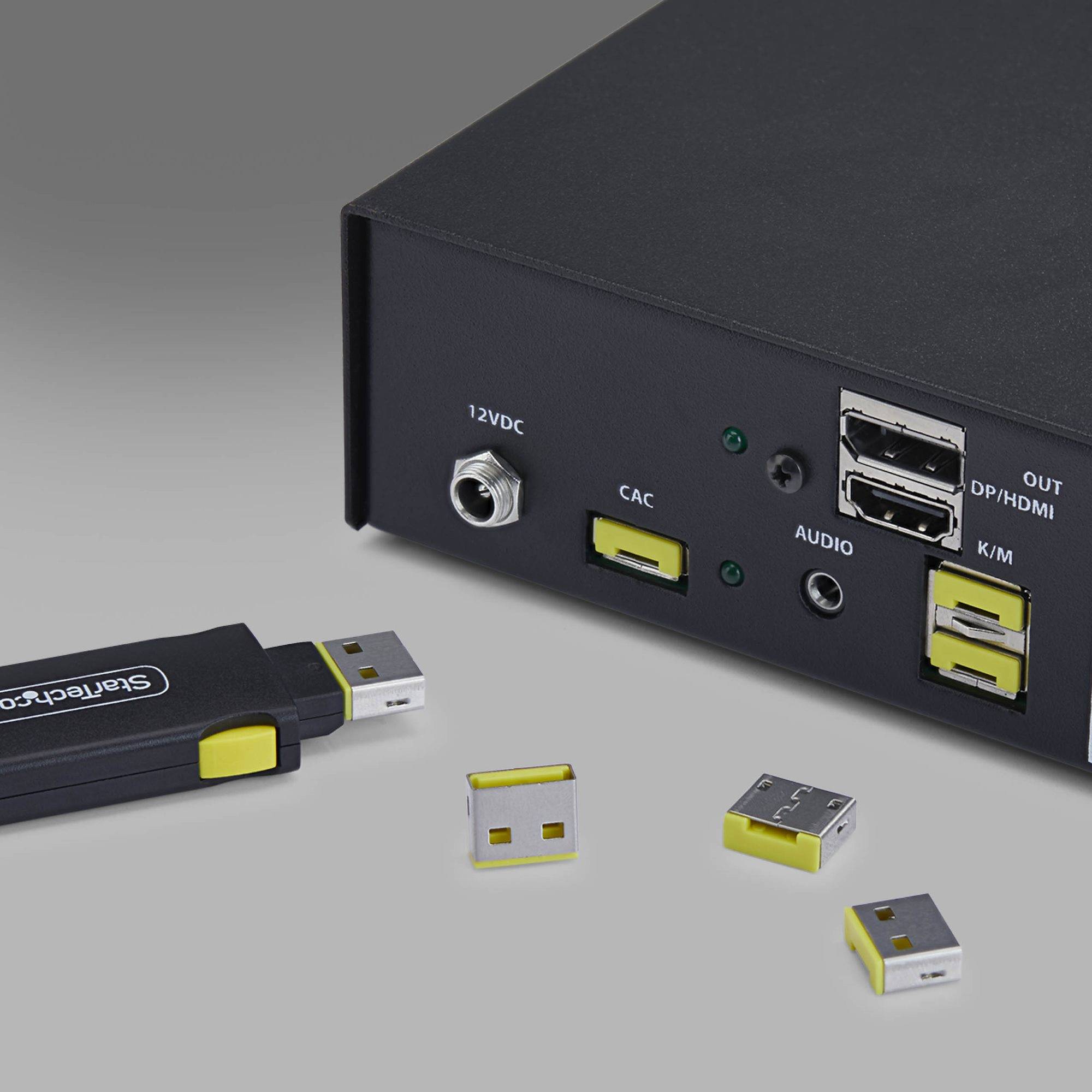 Nahaufnahme eines schwarzen Medienadapters mit Anschlüssen mit den Beschriftungen „12VDC