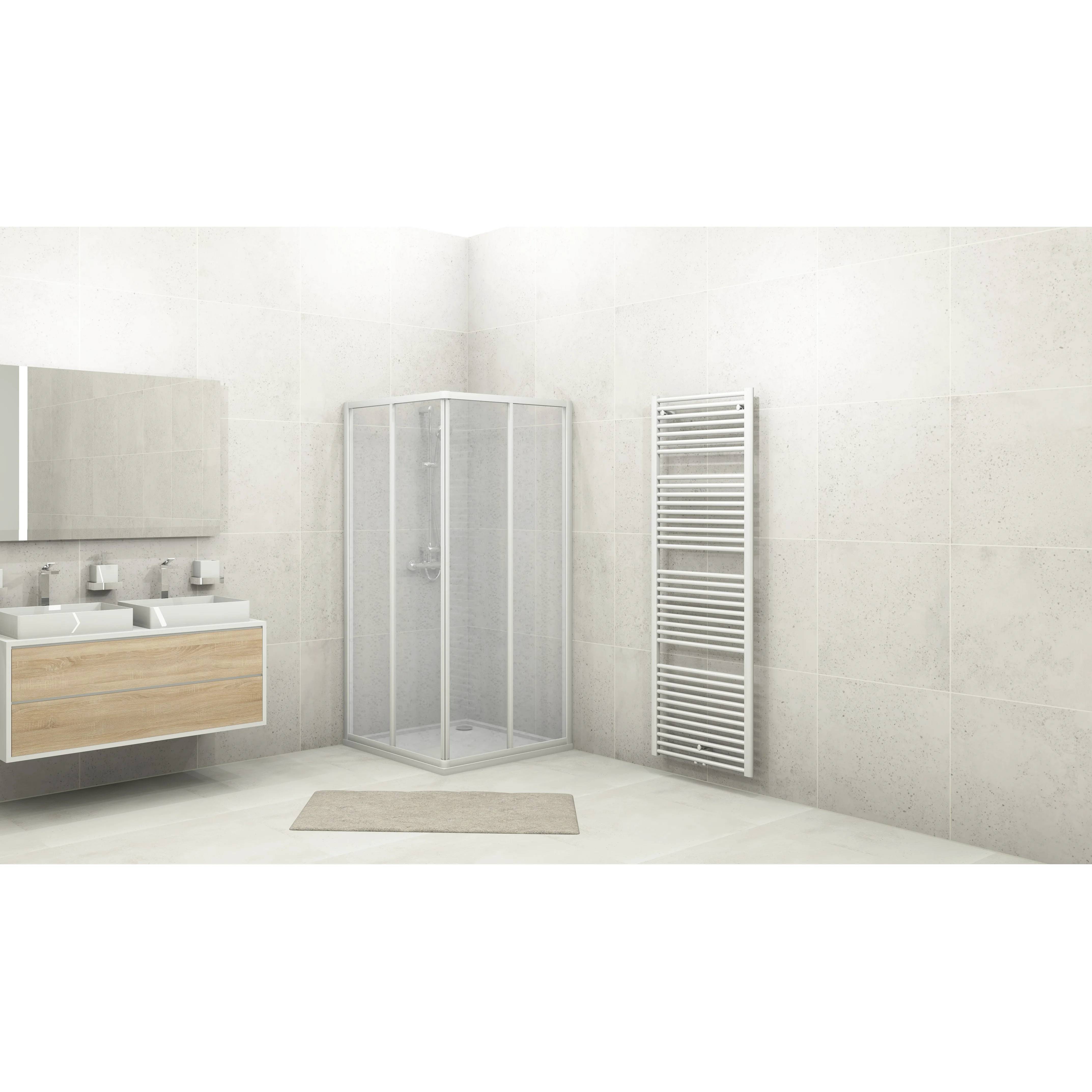 Minimalistisches modernes Badezimmer mit Eckduschkabine, schwebendem Doppelwaschtisch und hohem Wandheizkörper auf hellen Natursteinwänden.