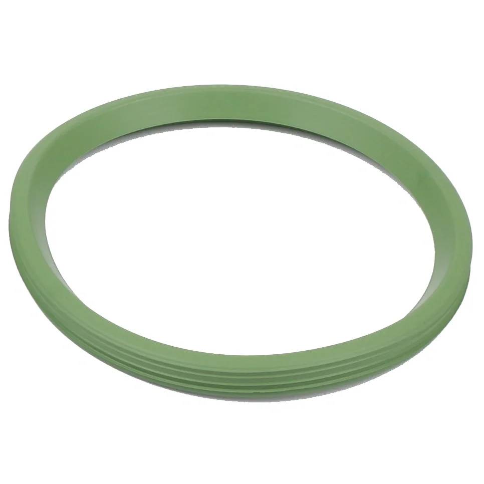 Ein grüner kreisförmiger Gummidichtungsring auf weißem Hintergrund.