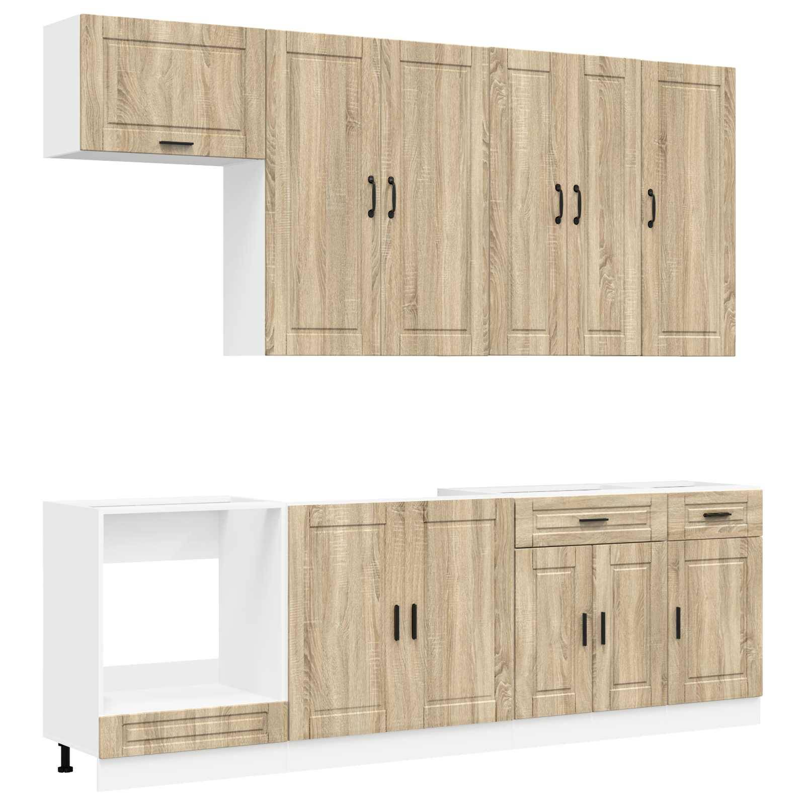 Zwei an der Wand montierte Küchenschrankeinheiten mit hellem Holzfinish und weißen Rahmen, die mehrere Türen und Schubladen in verschiedenen Konfigurationen zeigen.