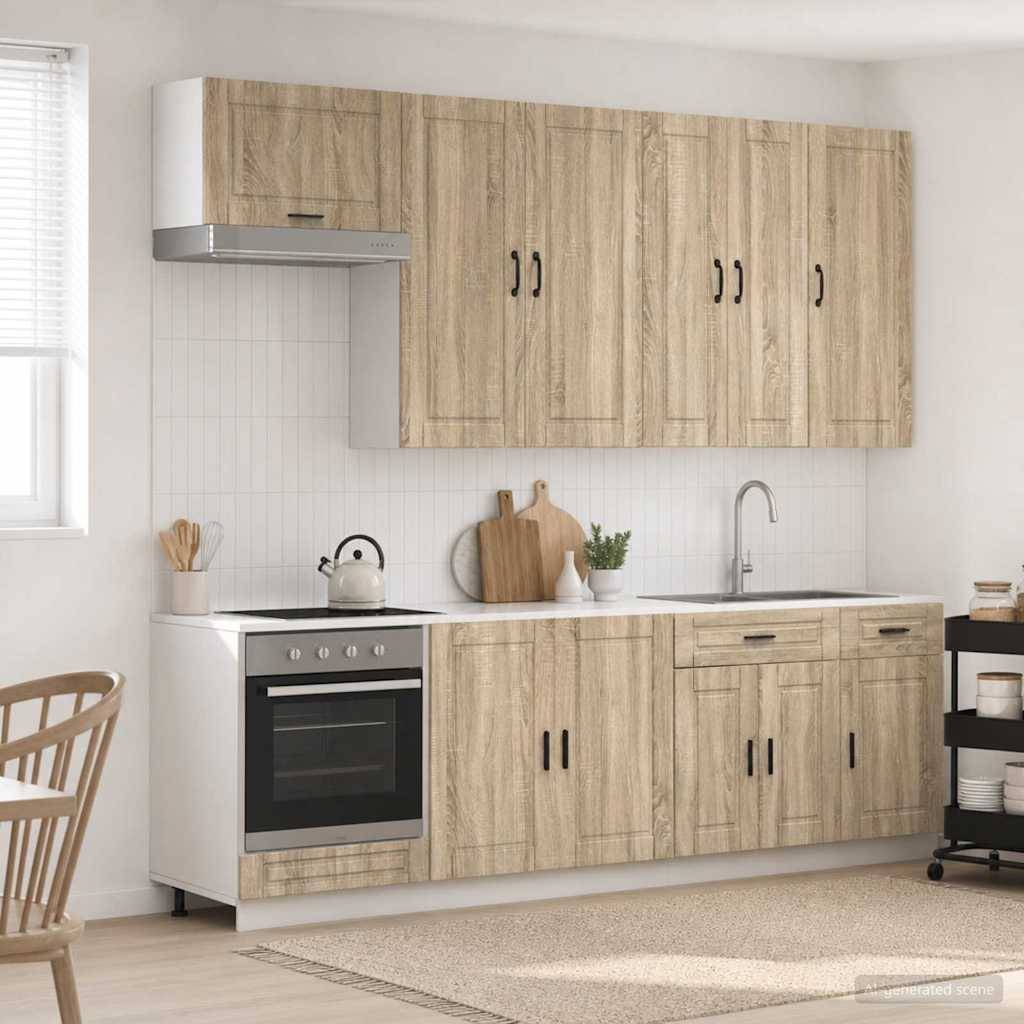 Moderne Küche mit hellem Holzschrank, eingebauter Ofen, Spüle, Kochfeld und einem kleinen Fenster; einfaches, aufgeräumtes Interieur.