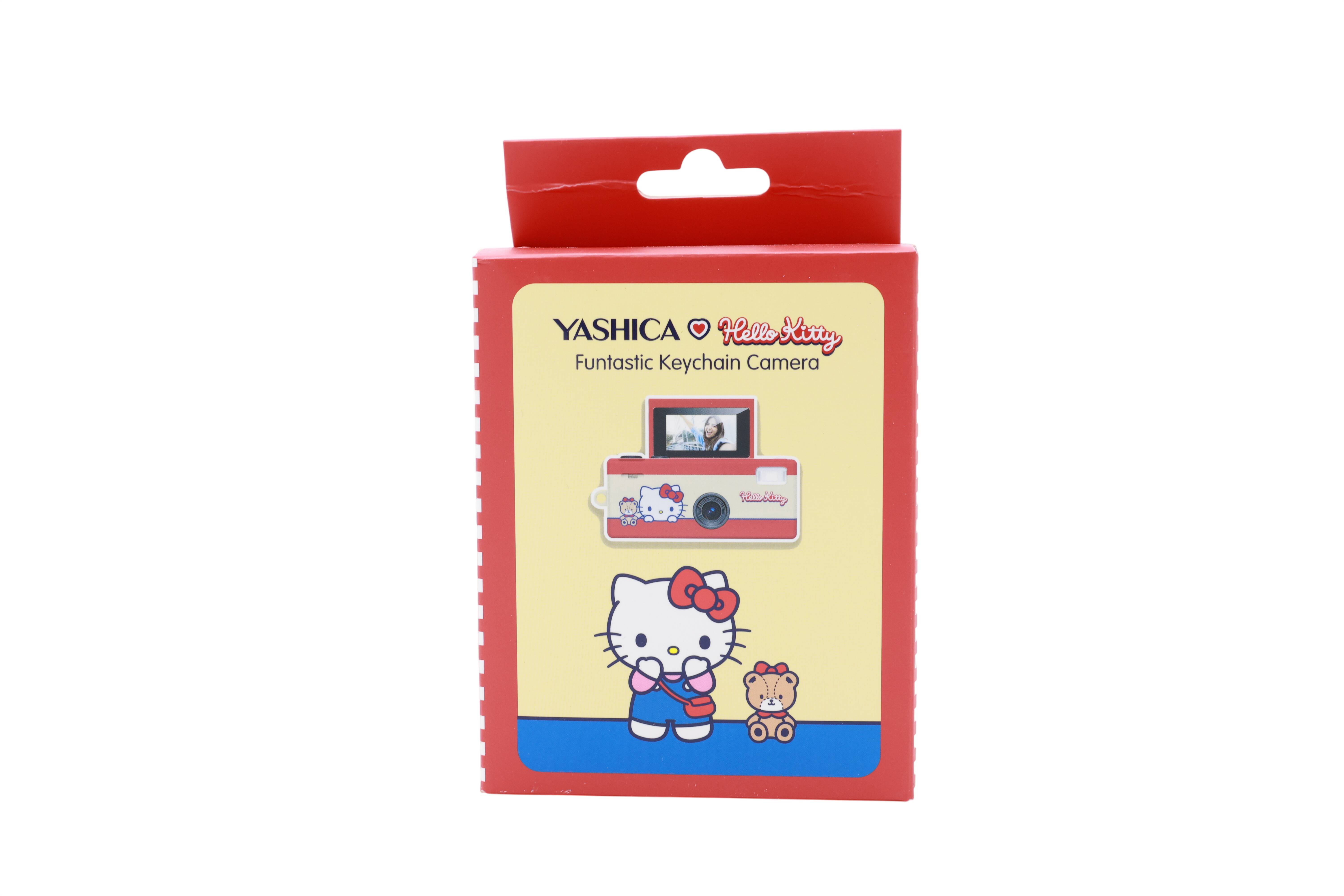 Rote Yashica Hello Kitty Fantastische Schlüsselanhänger-Kamera mit Produktabbildung und Hello Kitty Illustration auf der Vorderseite.