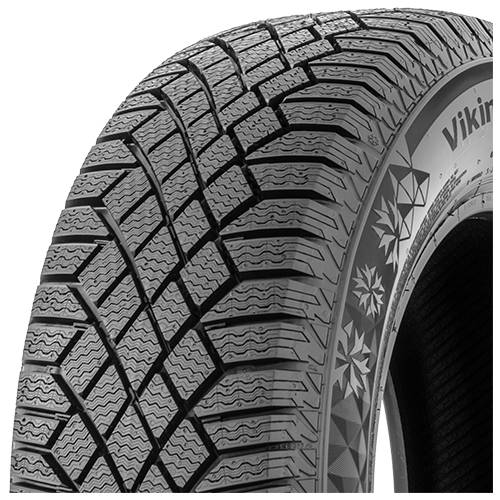 Nahaufnahme eines Winterreifenprofils, das tiefe Zickzack-Rillen und Seitenwandkennzeichnung auf schwarzem Hintergrund zeigt.