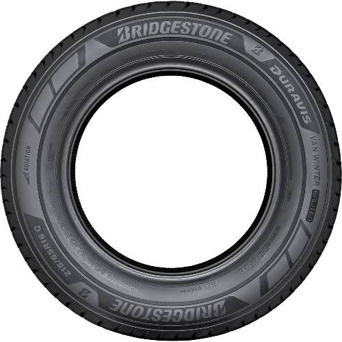 Ein schwarzer Bridgestone Blizzak Winterreifen von vorne vor dunklem Hintergrund gezeigt.