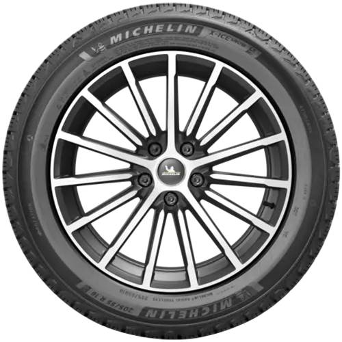 Nahaufnahme eines Autorads mit einer schwarzsilbernen mehrspeiches Leichtmetallfelge und einem Michelin-Reifen.