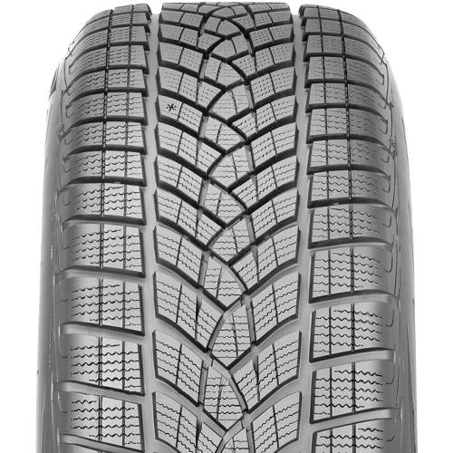 Nahaufnahme einer Autoreifenlauffläche mit tiefen V-förmigen Rillen und dichter Lamellierung für Wintertraktio​n.
