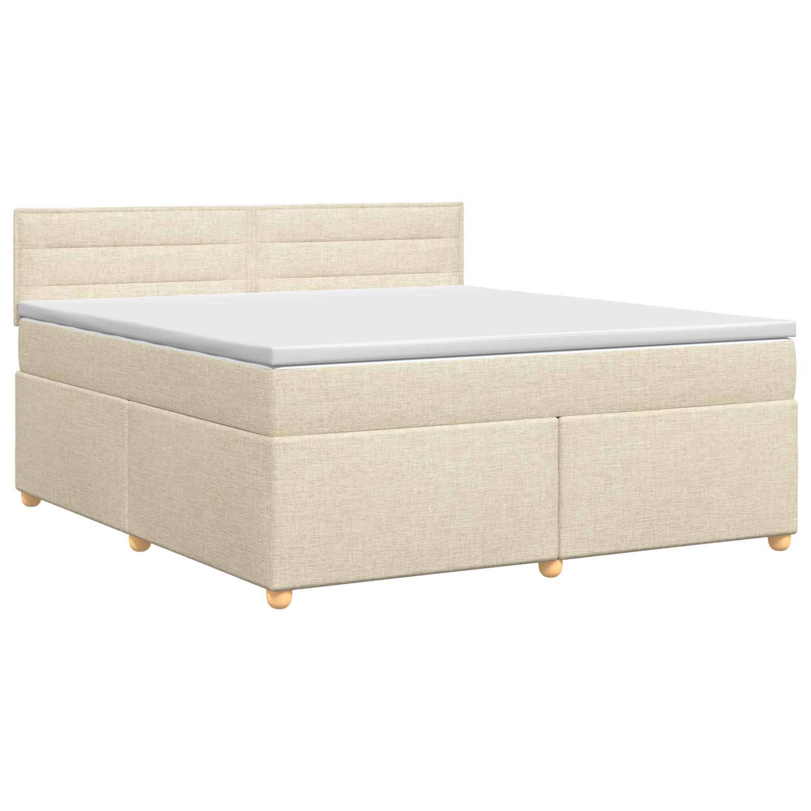 Beige gepolstertes Bett mit Kopfteil und Matratze auf weißem Hintergrund.