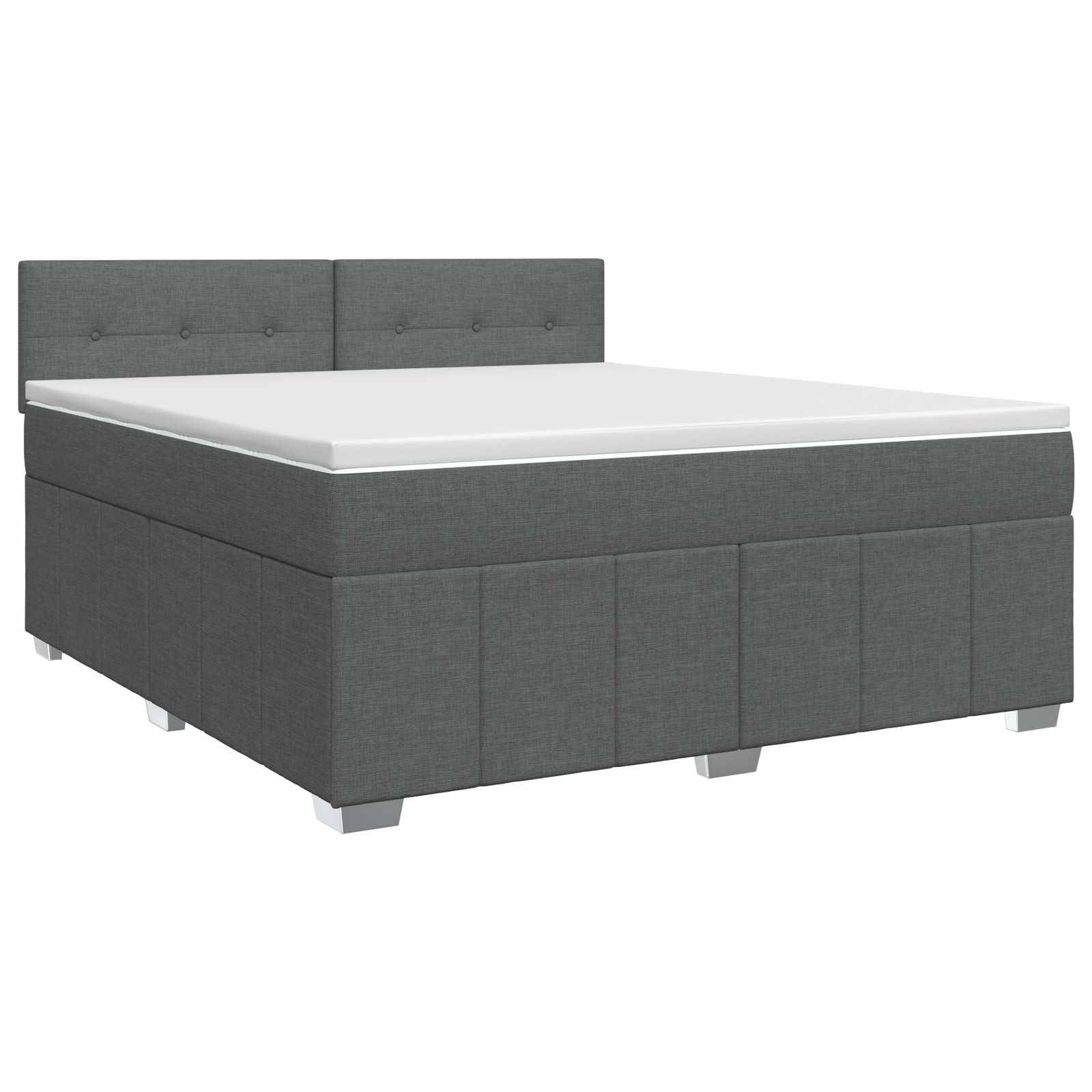 Grau gepolstertes Bett mit Kopfteil und weißer Matratze auf einfachem Hintergrund.